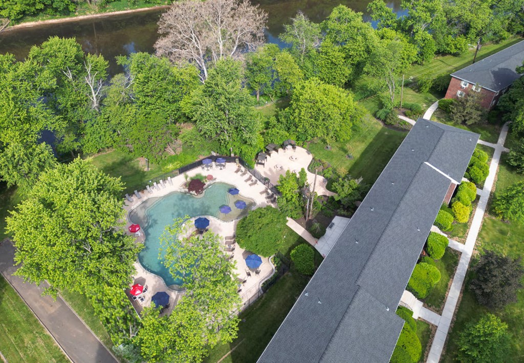 A beautiful aerial view of a park with a playground and a walking path.