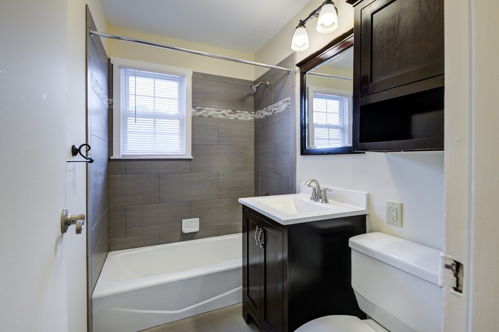 A bathroom with a white sink and a bathtub at Rivercrest Apartments, Piscataway , NJ, 08854