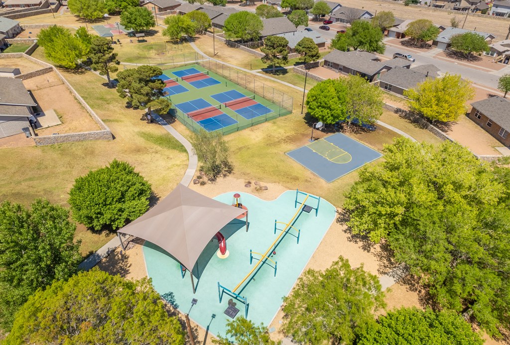 an aerial view of a playground and basketball court in a park  at The Village at Cottonwood Springs, El Paso, 79934
