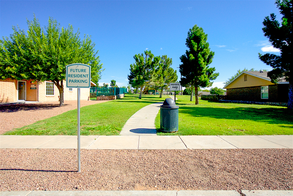 a sidewalk leading to the apartments at The Village at Cottonwood