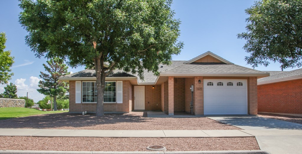 Exterior view of a house with private garage at The Village at Cottonwood Springs in El Paso, Texas