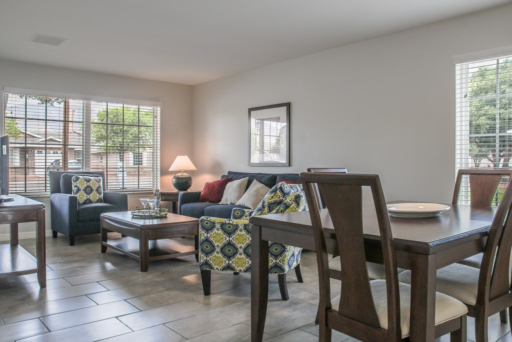 Open concept floor plan with living room and dining room at Village of Cottonwood Springs in El Paso, TX