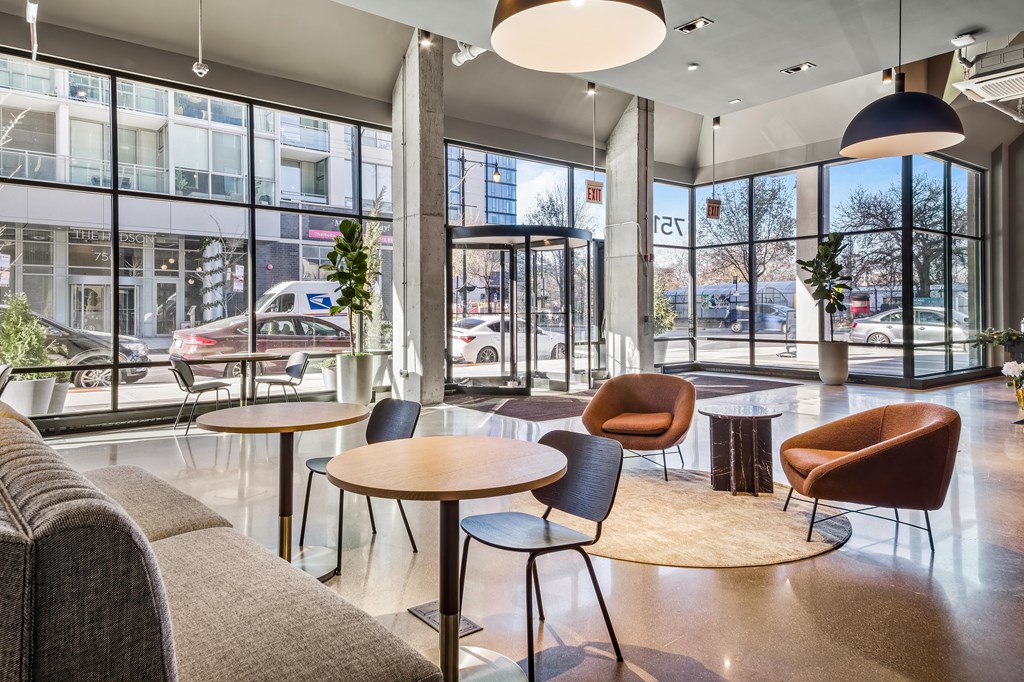 A modern cafe with a view of the street outside.