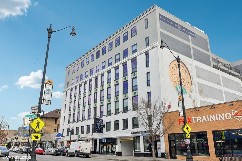 A street view of a building with the word "FOXTRAINING" on the side.