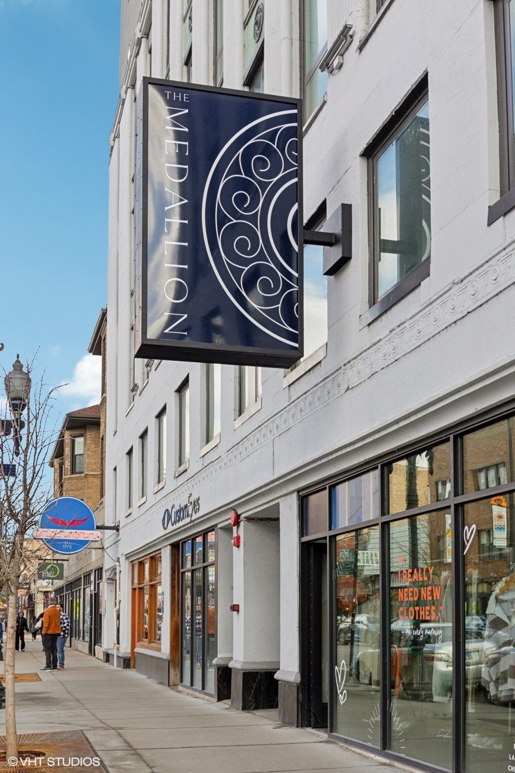 A storefront with a sign that says "The Meditation" hanging from the building.