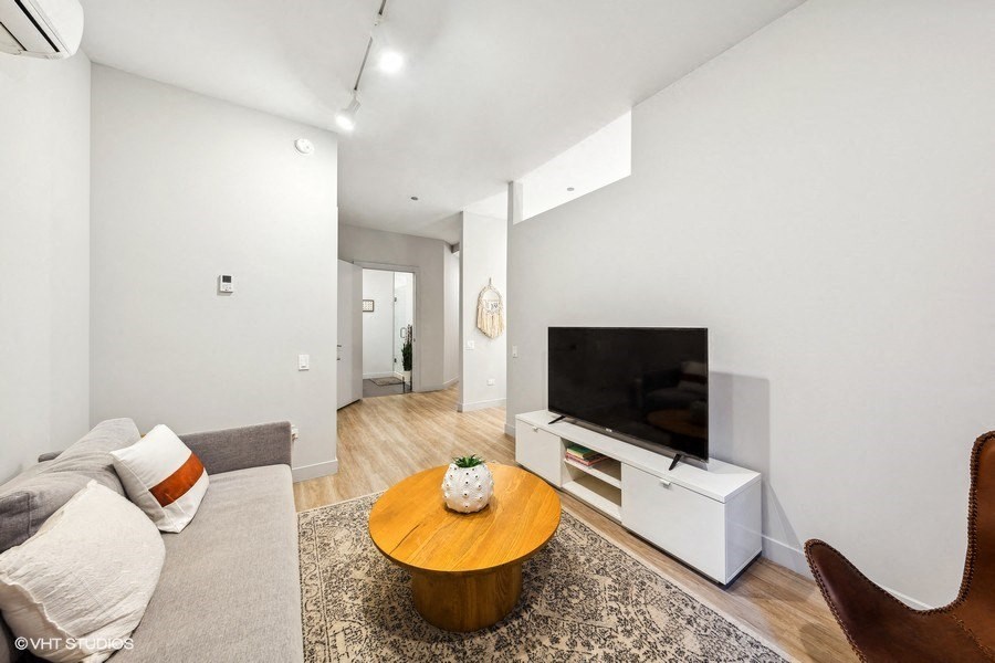 a living room with a couch and a television