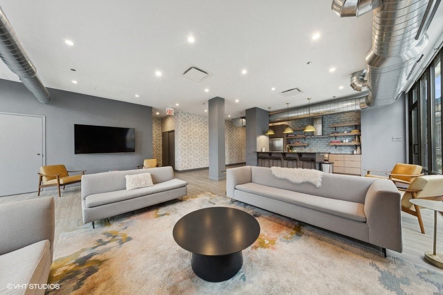 a living room with couches and a coffee table