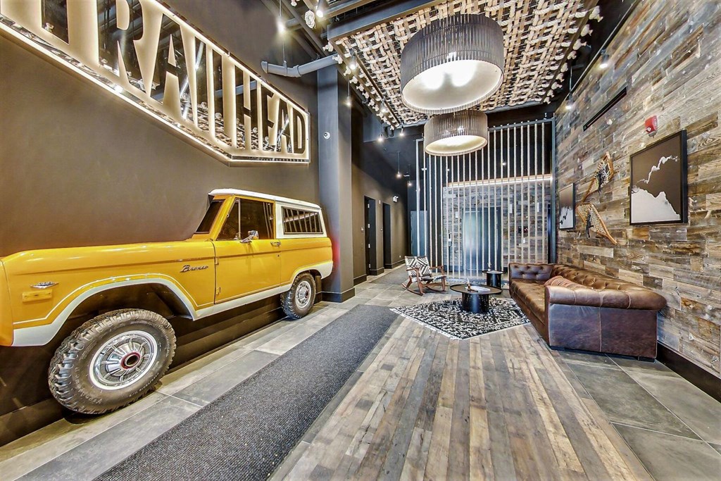 a yellow truck is parked in the lobby of a building