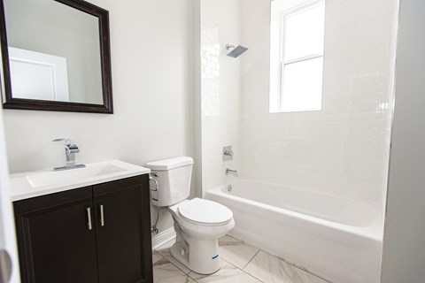 an empty bathroom with a toilet and a sink