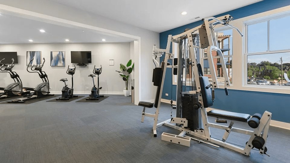 A well-equipped gym with a variety of exercise machines.