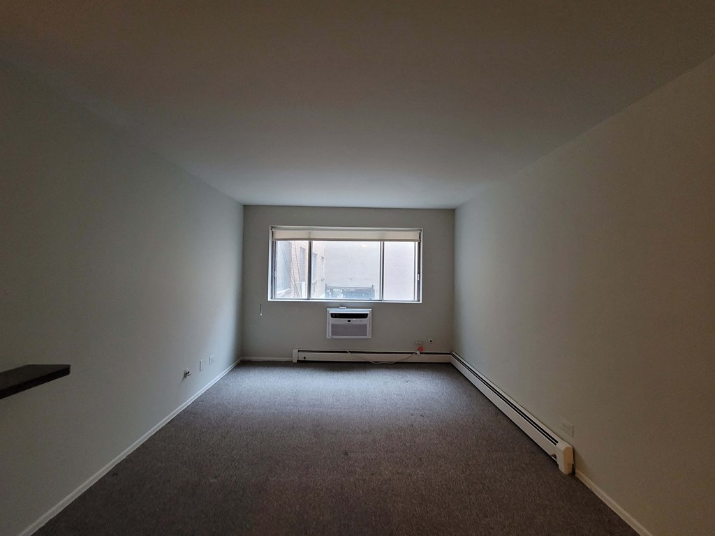 an empty room with a window in it