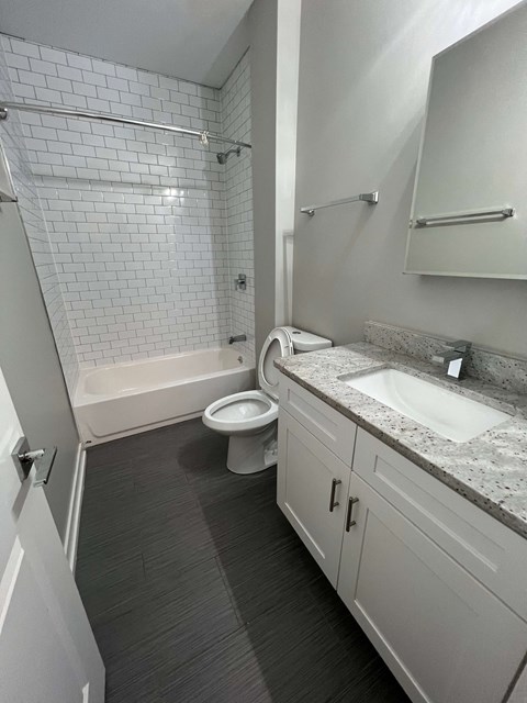 a bathroom with a sink toilet and bathtub