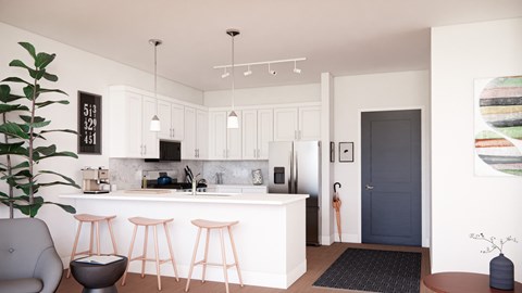 A modern kitchen with white cabinets and a bar area.