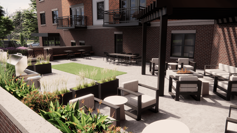 A patio with chairs and tables is surrounded by a brick building.
