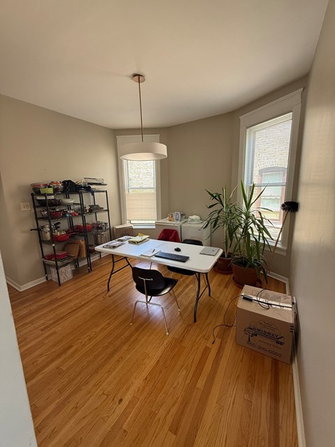 A room with a desk and a chair.