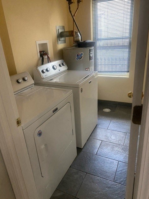 a small kitchen with a washing machine and a dryer
