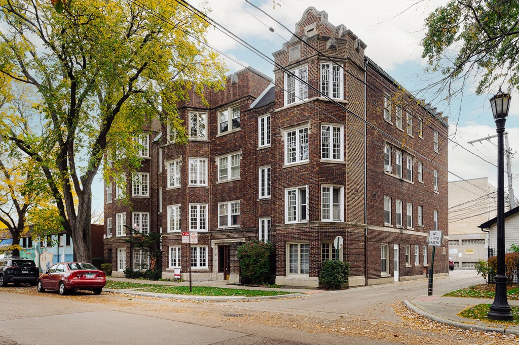 a red brick building on the corner of a street
