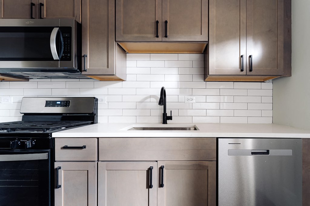 a group of people standing in a room with a projector