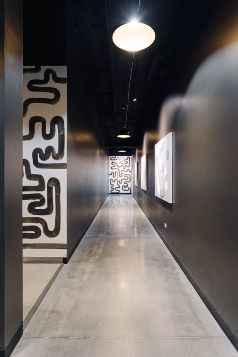 A long hallway with a light at the end.