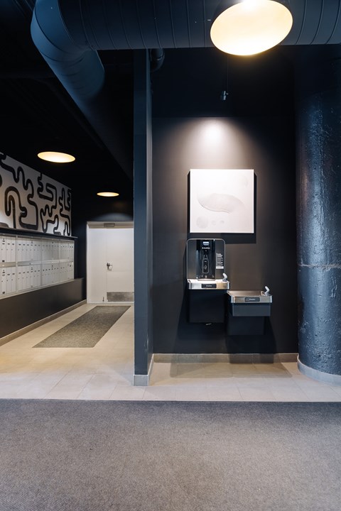 A bathroom with a sink and mirror on the wall.