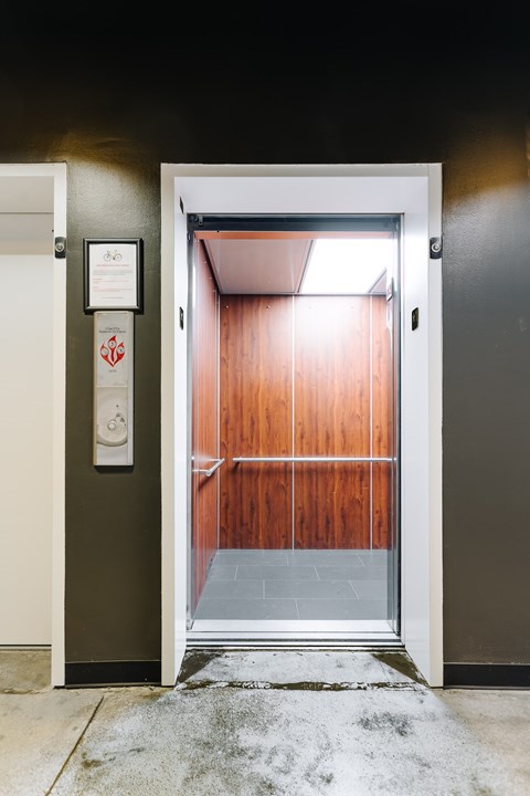 A white door with a sign on the wall next to it.