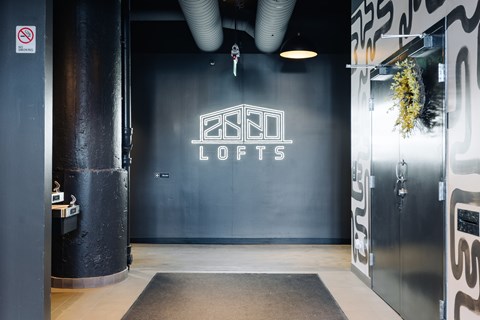 A black and white image of a room with a sign that says "2520 lofts".