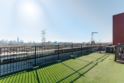 A sunny day at the rooftop with a view of the city skyline.