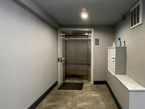 A hallway with a metal detector at the end.