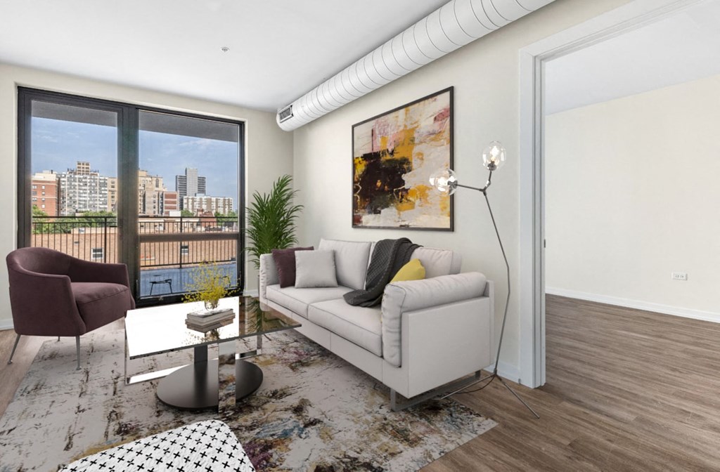 a living room with a white couch and a large window