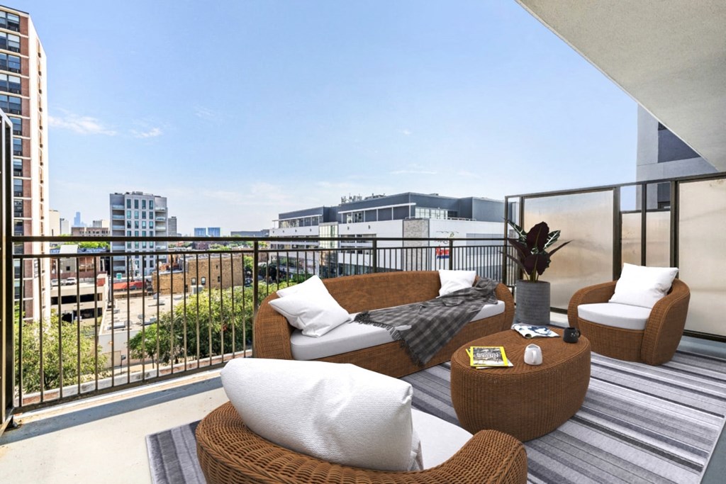 a balcony with couches and chairs and a view of the city