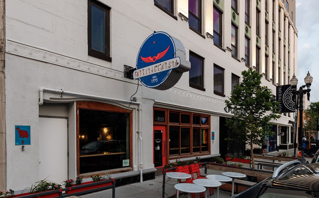 a building with a blue sign on the side of it