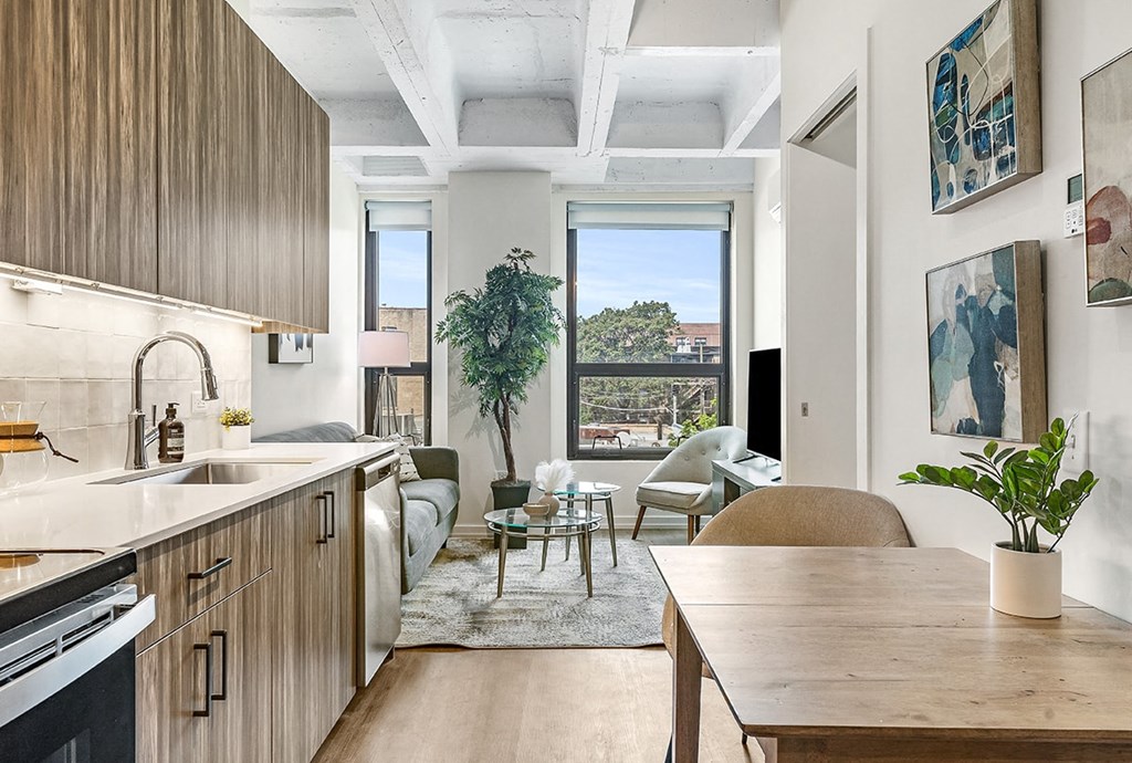 a kitchen and living room in an apartment