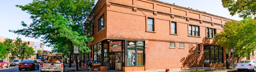 a brick building on the corner of a city street