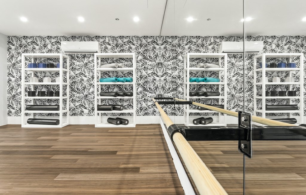 a bowling alley in a store with black and white wallpaper
