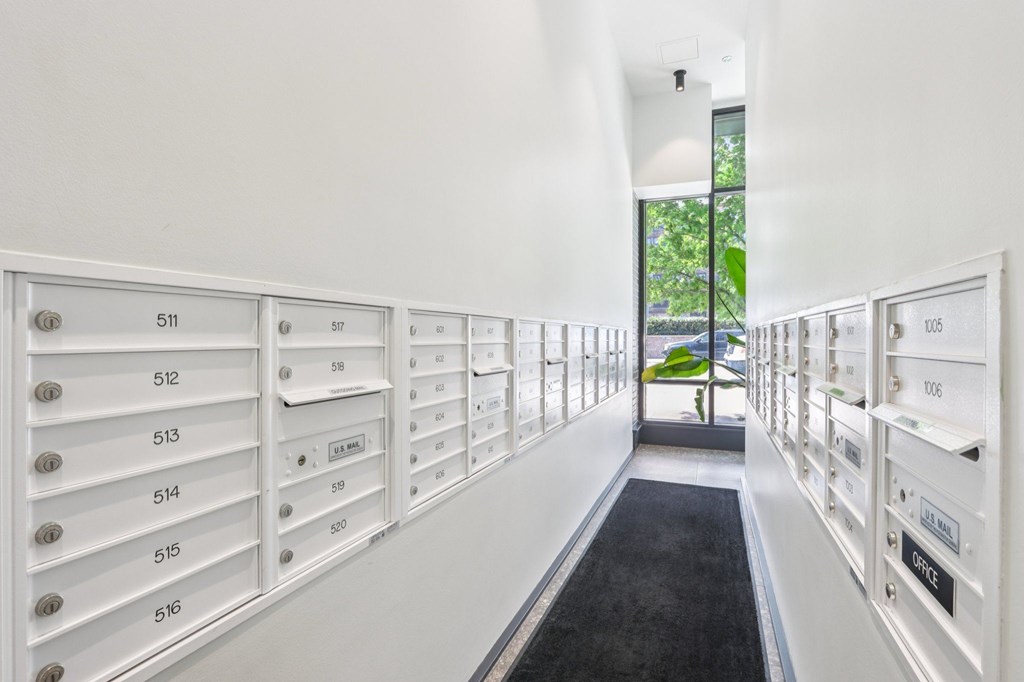 A long hallway with mailboxes numbered from 511 to 516.
