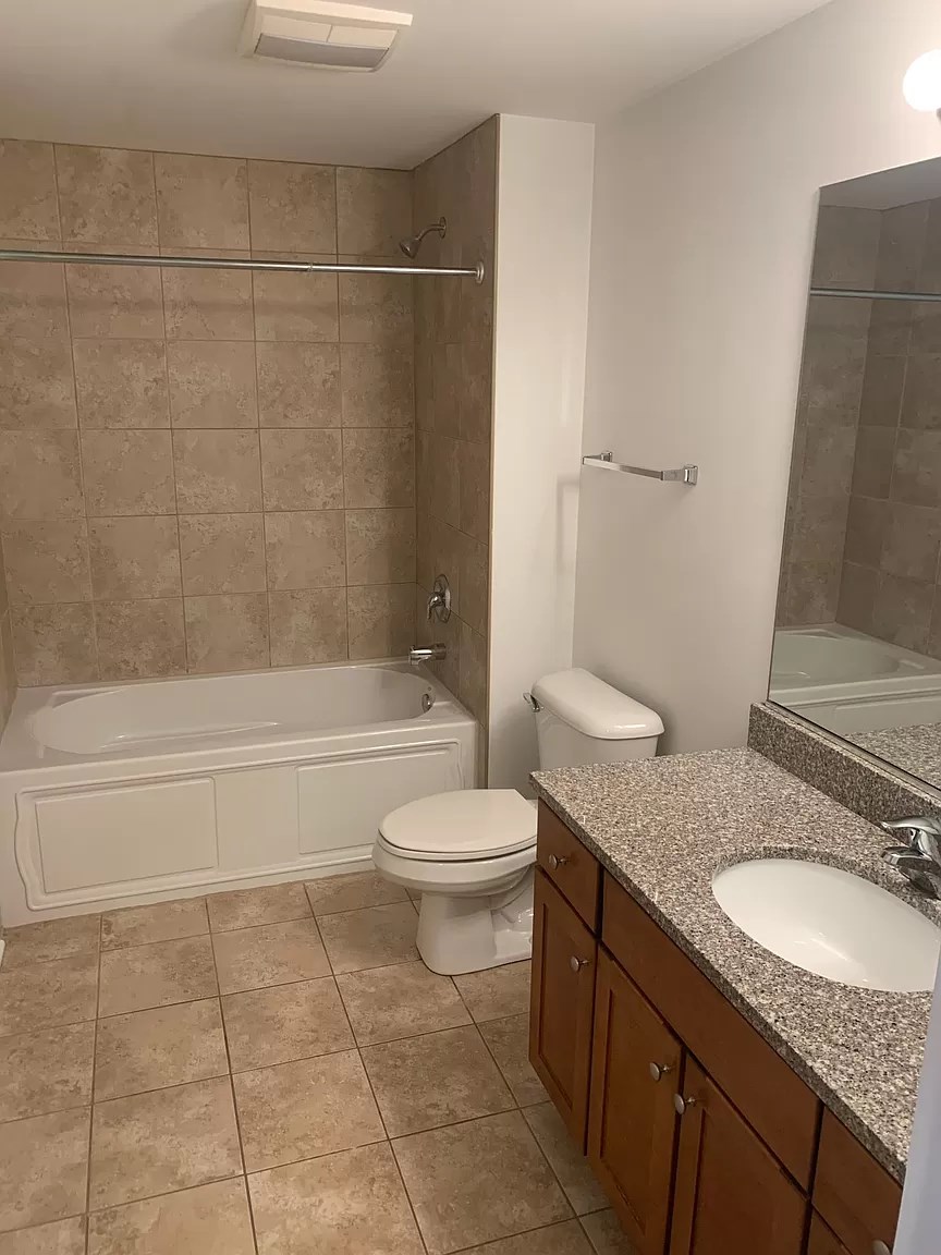 a bathroom with a sink toilet and a bath tub