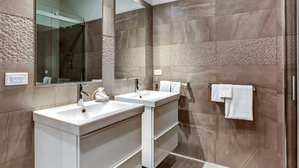 A bathroom with a white sink and a mirror.