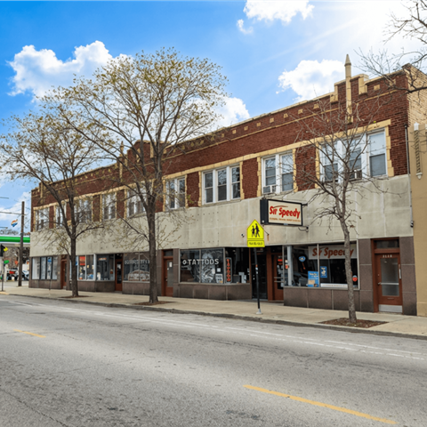 A street view of a building with a sign that says "St. Speedy's".