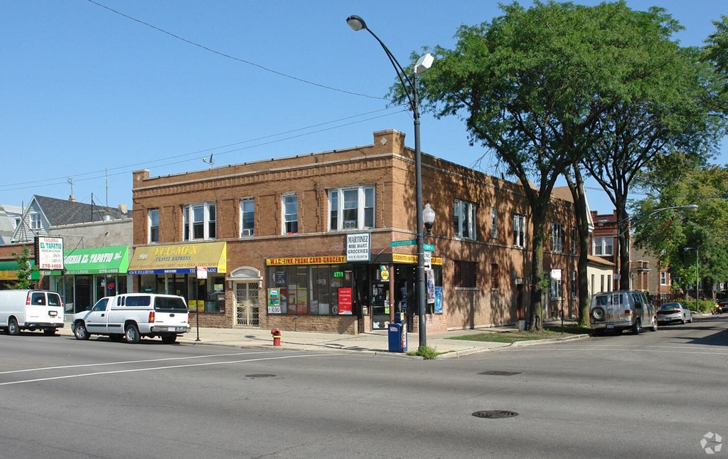 a brick building on the corner of a city street