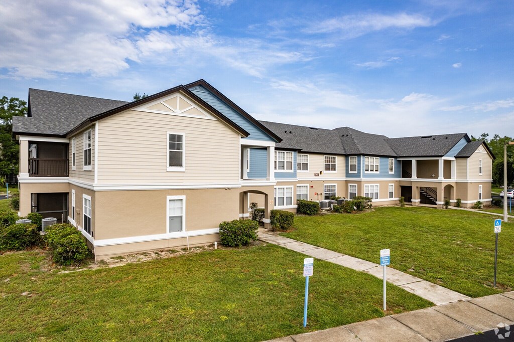 A row of houses with a blue sky above.