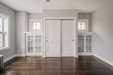 A room with white doors and windows.