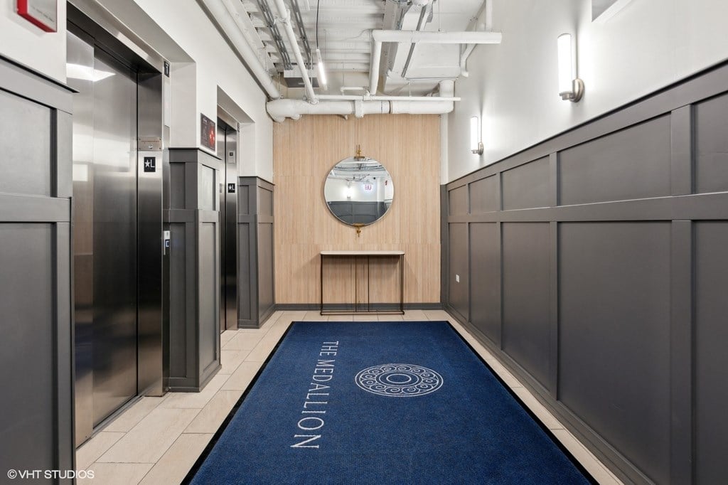 A hallway with a blue carpet and a sign that says "The Removal".