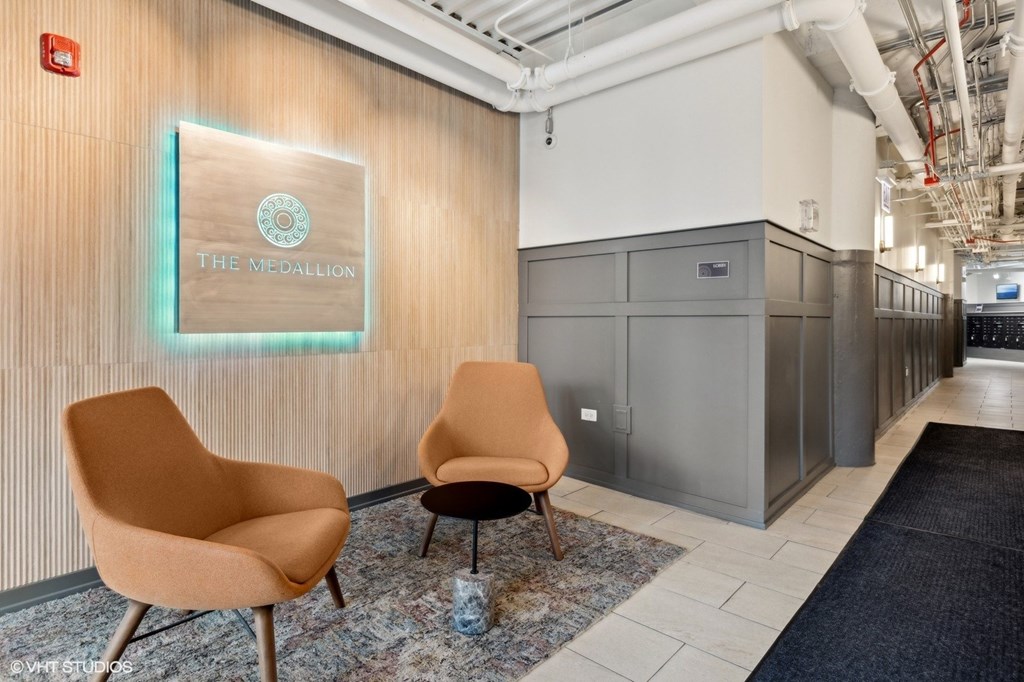 Two chairs are placed in front of a sign that says "The Medallion".