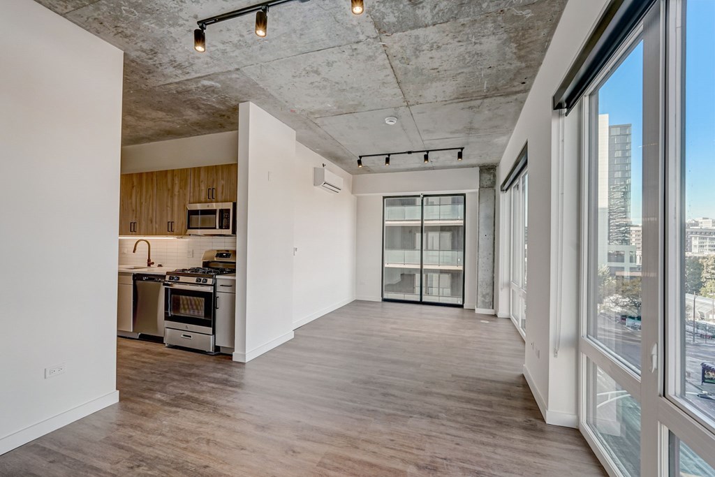 A kitchen with a stove top oven and a microwave.
