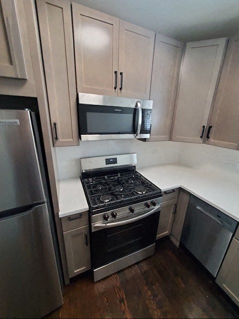 a kitchen with a stove and a microwave