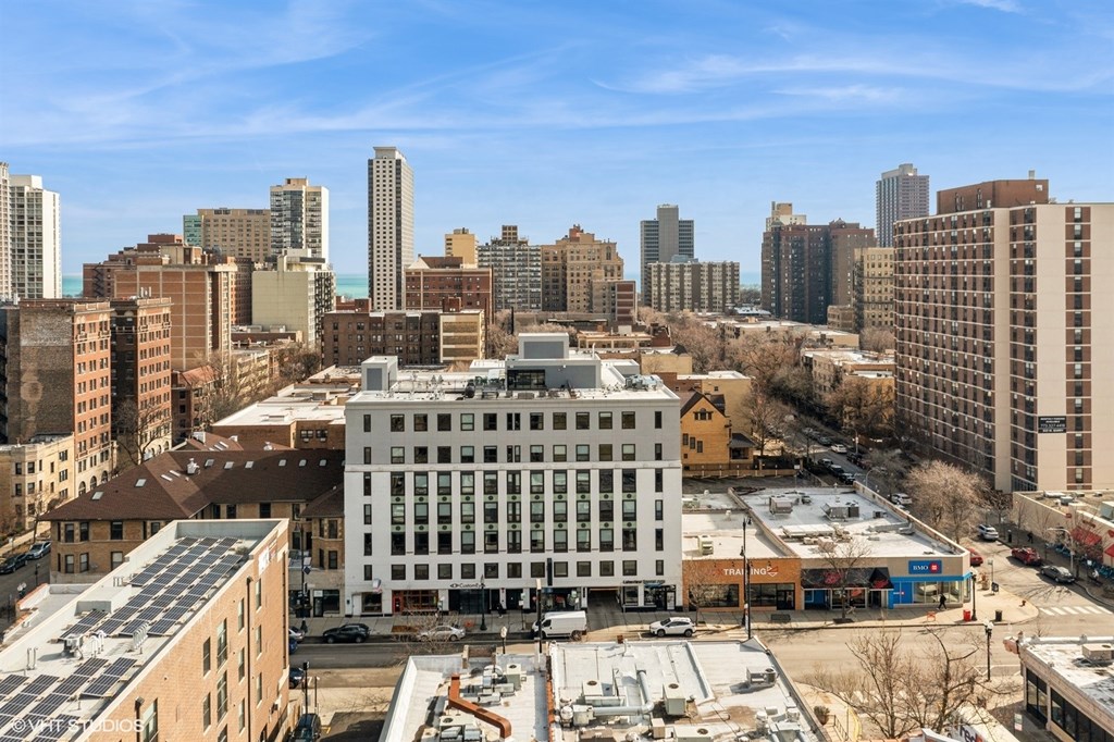 A cityscape with a large white building in the center.