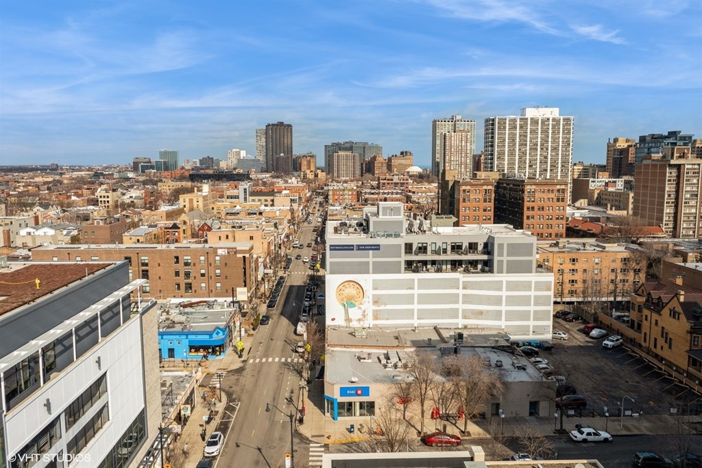 A city street with buildings and cars.