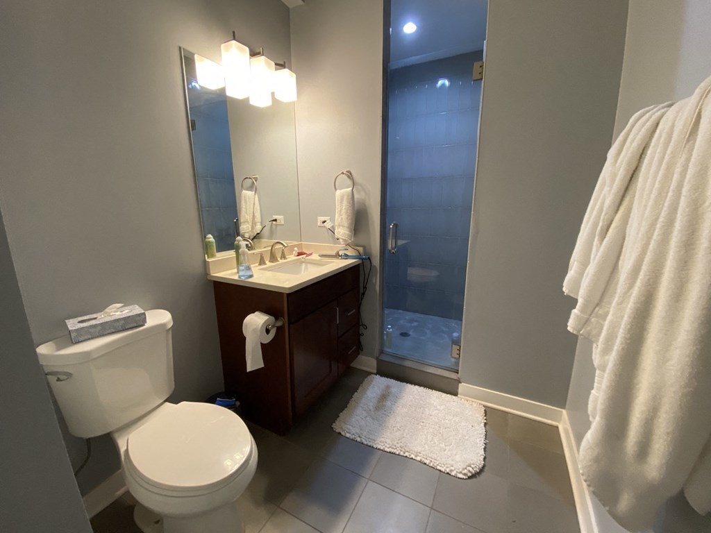 a small bathroom with a toilet sink and shower