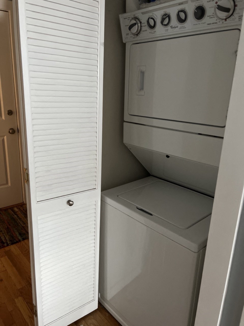 the closet has a washer and dryer in it