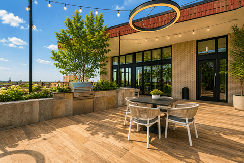 A patio with a table and chairs is set up outside a building.